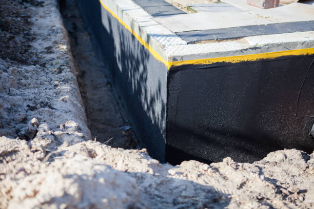 Professional Basement Waterproofing technician working in Stoutsville, OH